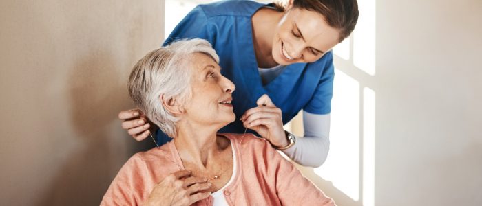 Shot of a senior woman in a wheelchair being cared for a nurse